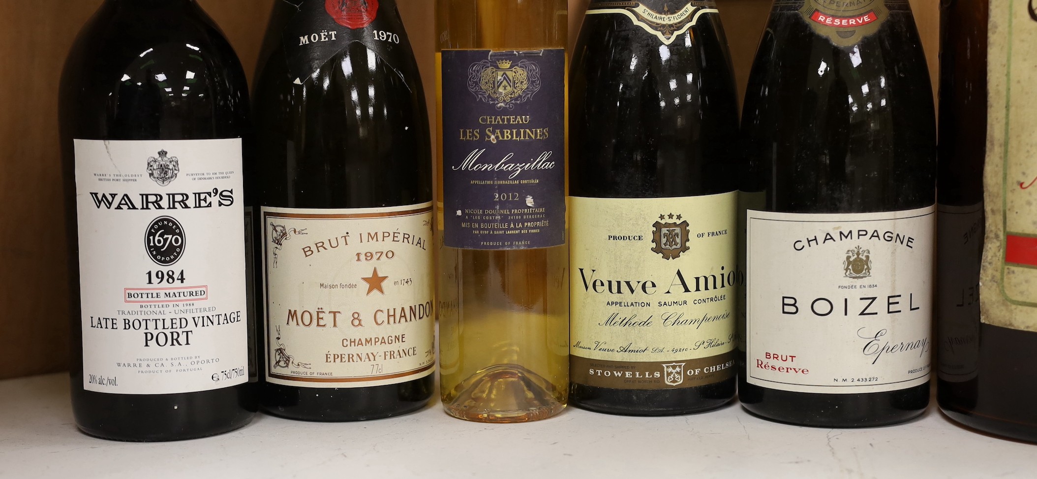 Various bottles of champagne, wine and brandy including a 1984 Warre's vintage port and a 1970 Moet & Chandon (7)